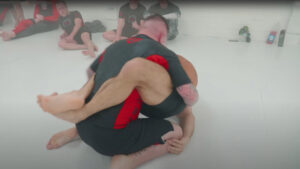 reaching through for an armbar from closed guard